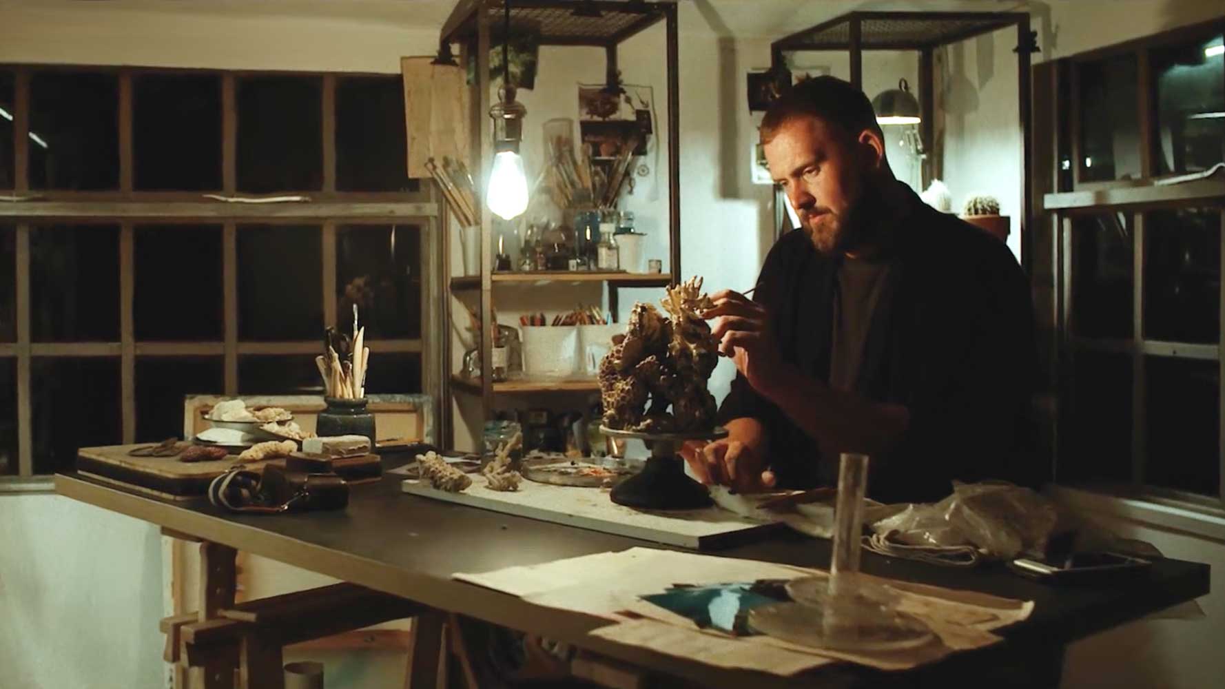 UK artist and sculptor Samuel Baker working in his studio